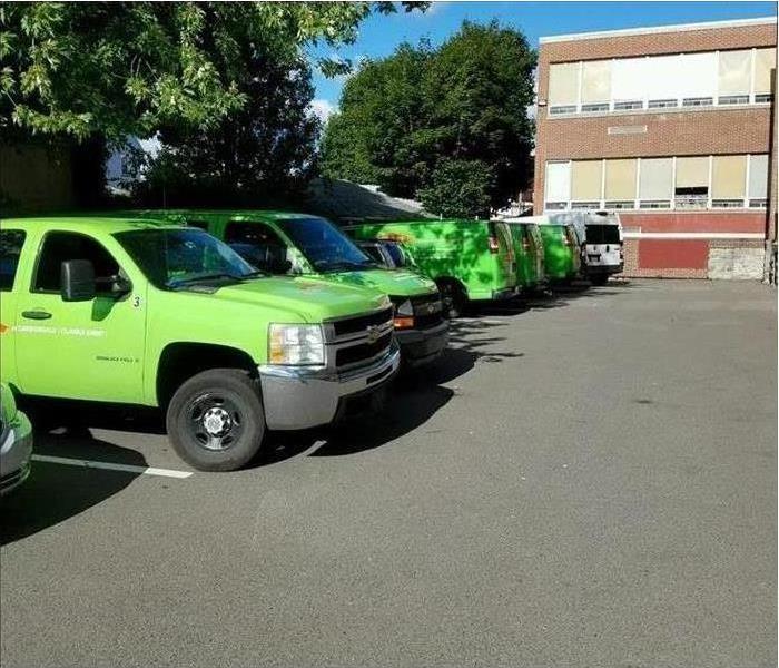 SERVPRO trucks in front of commercial building